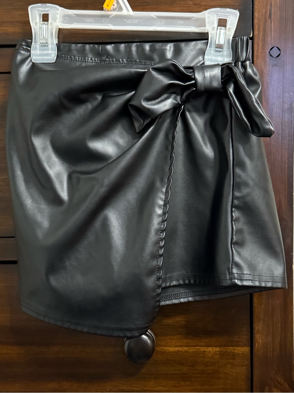 Black Faux Leather Bow Wrap Mini Skirt‎